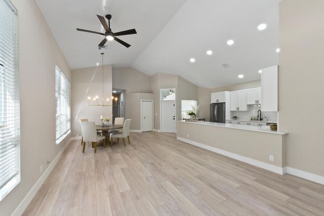 a view of kitchen with sink and wooden floor