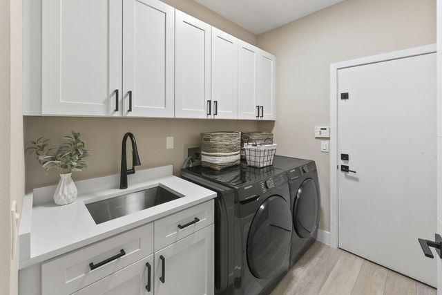 a kitchen with a sink and cabinets