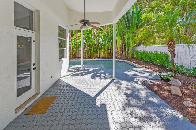 a very nice looking room with a large window and chandelier