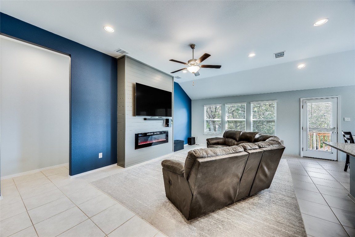 21302 Santa Rosa Avenue Lago Vista, TX 78645 - Photo 10 of 26 a living room with furniture and a flat screen tv