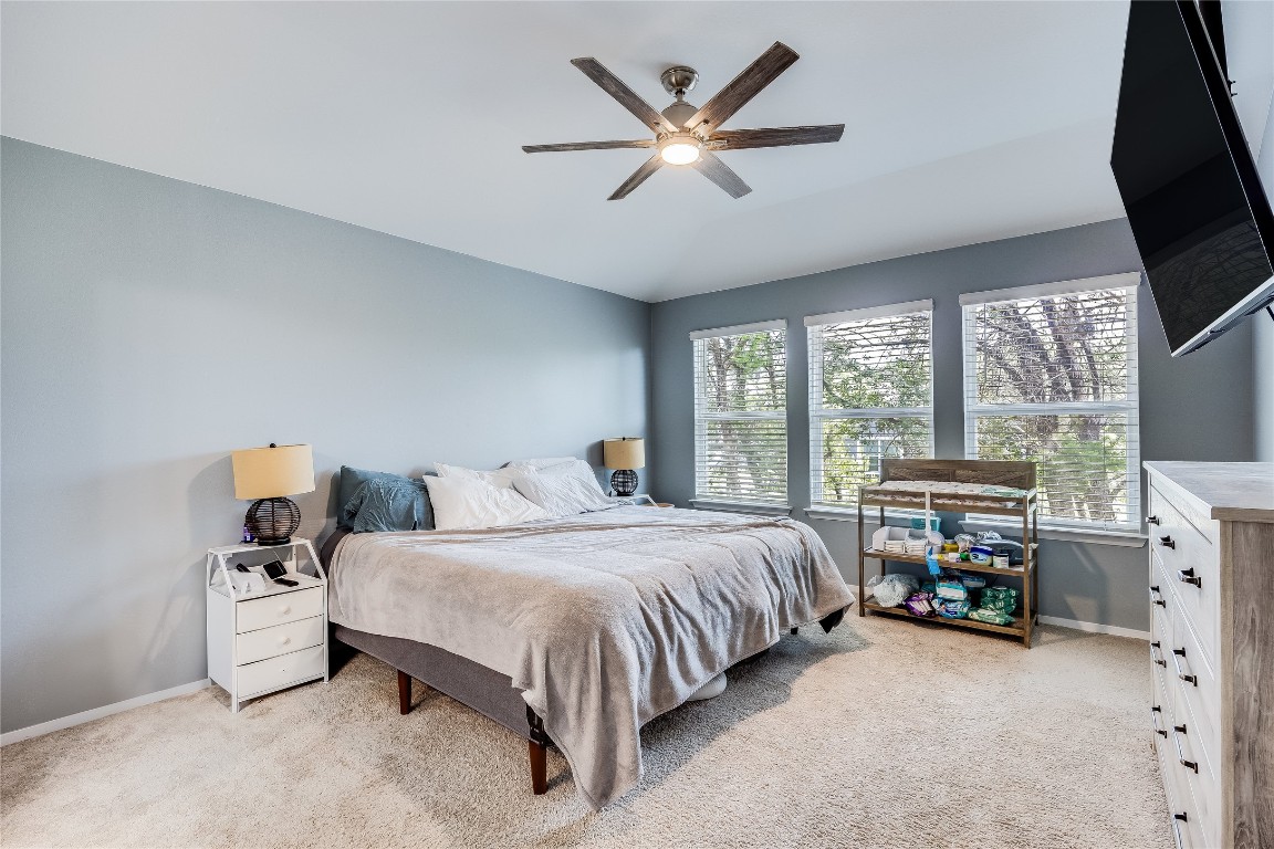 21302 Santa Rosa Avenue Lago Vista, TX 78645 - Photo 13 of 26 a bedroom with a bed and a large window