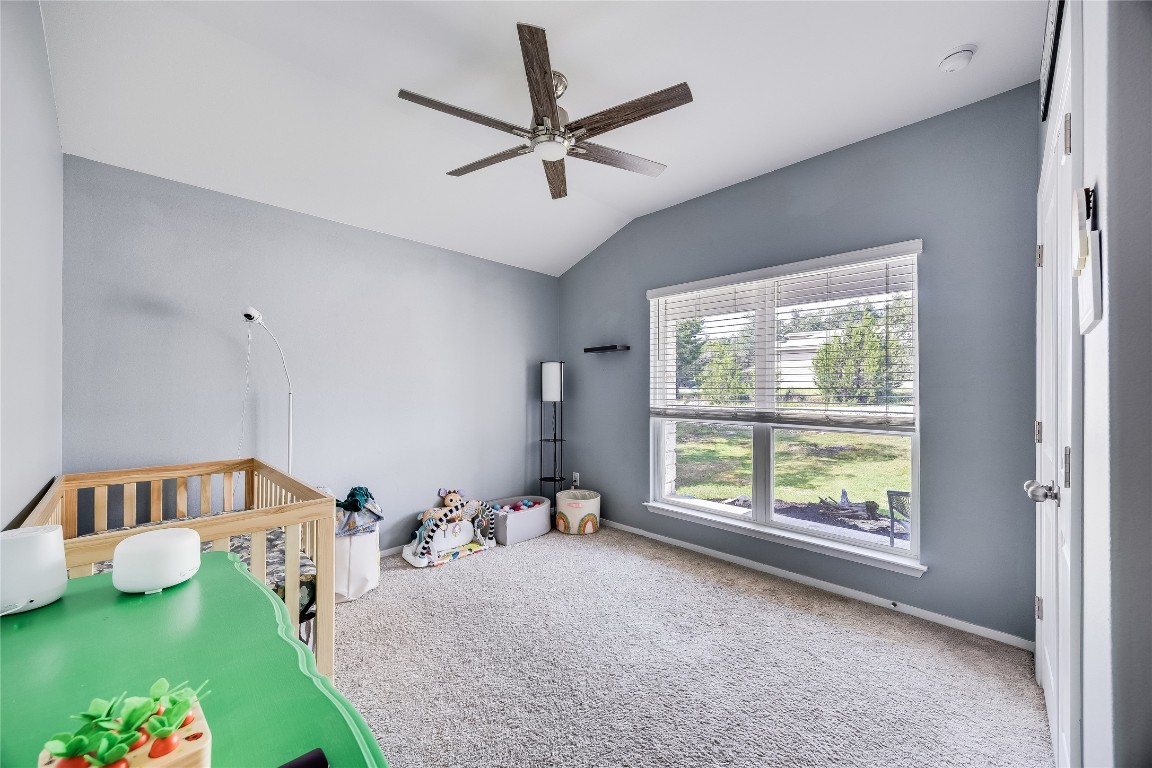 21302 Santa Rosa Avenue Lago Vista, TX 78645 - Photo 14 of 26 a bedroom with bed and a window