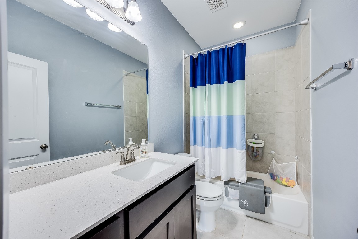21302 Santa Rosa Avenue Lago Vista, TX 78645 - Photo 17 of 26 a bathroom with a sink double vanity and a mirror