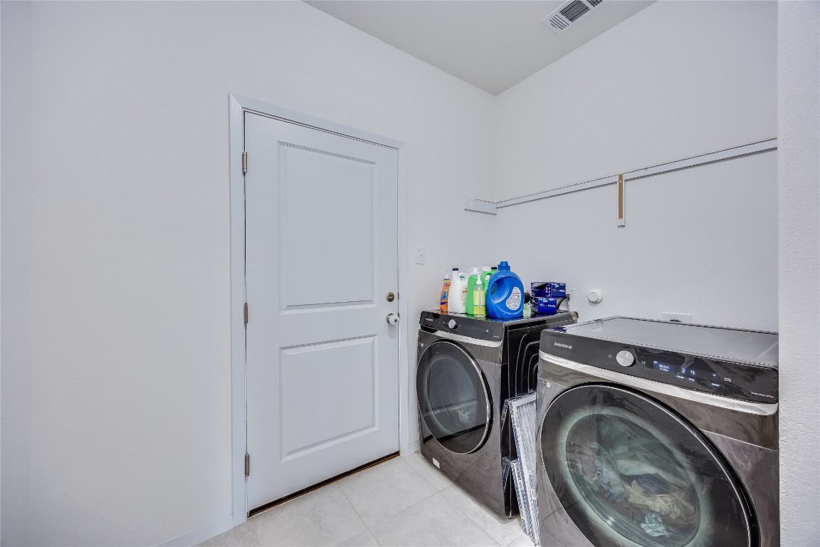 21302 Santa Rosa Avenue Lago Vista, TX 78645 - Photo 18 of 26 a utility room with dryer and washer