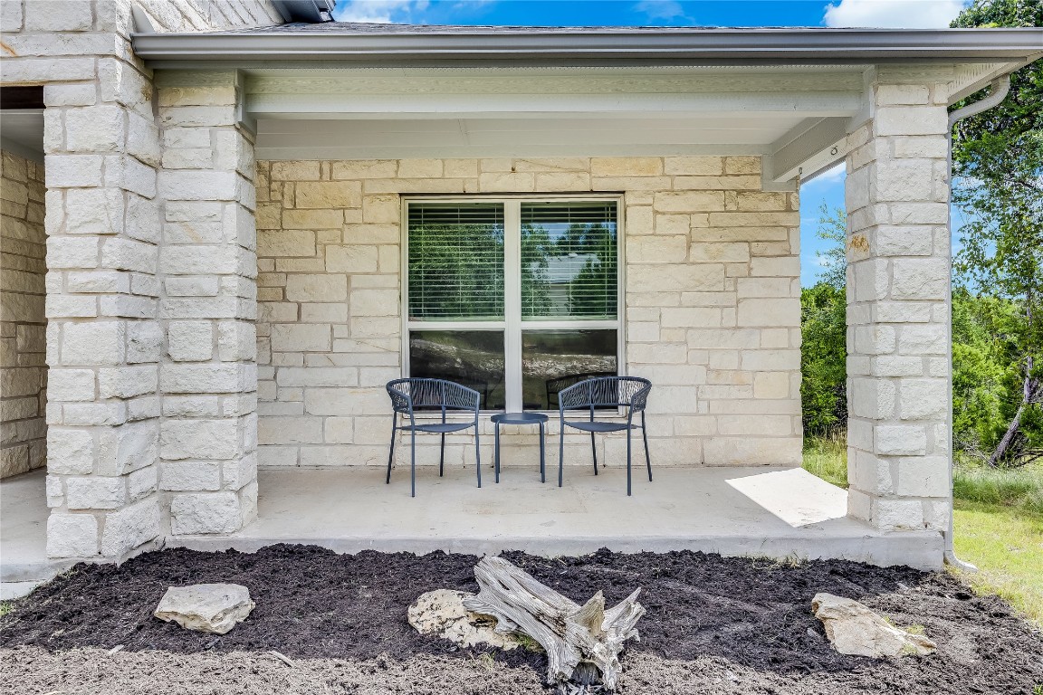 21302 Santa Rosa Avenue Lago Vista, TX 78645 - Photo 5 of 26 a view of a patio with couple of chairs