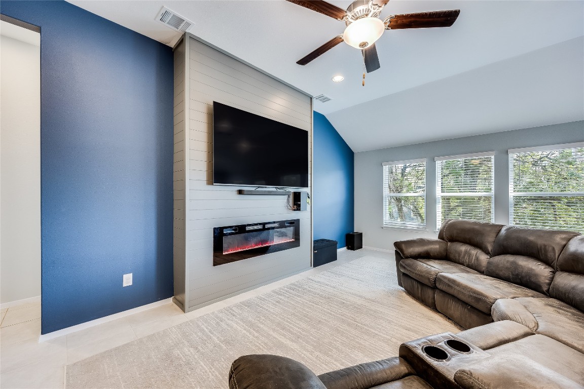 21302 Santa Rosa Avenue Lago Vista, TX 78645 - Photo 8 of 26 a living room with furniture and a flat screen tv