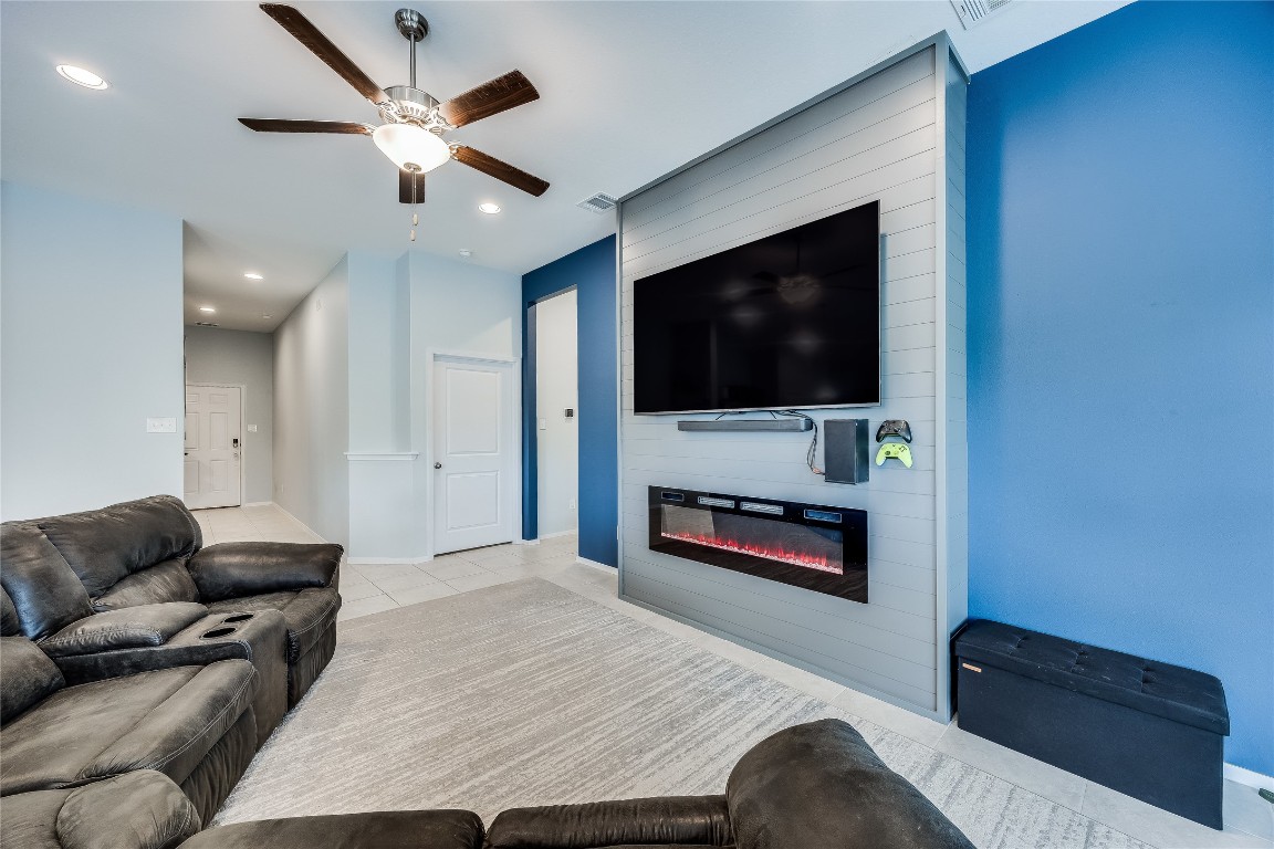 21302 Santa Rosa Avenue Lago Vista, TX 78645 - Photo 9 of 26 a living room with furniture and a flat screen tv