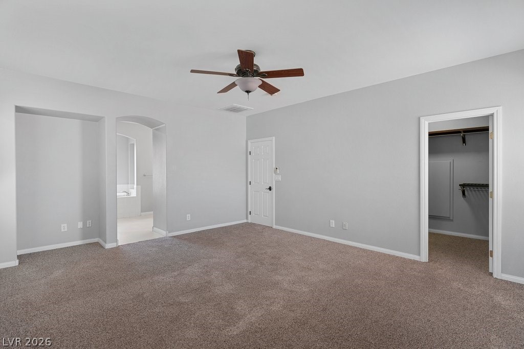 10336 Hawk Ravine Street Las Vegas, NV 89178 - Photo 28 of 59 This Primary Bedroom features convenient access to a walk-in closet with Custom Shelving.