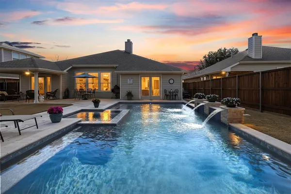 a swimming pool with outdoor seating