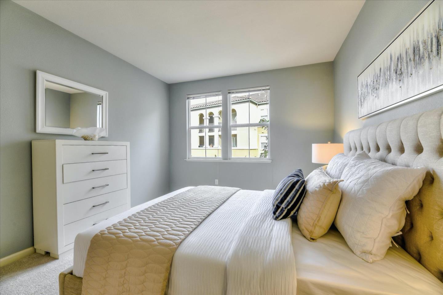 1883 Agnew Road, Unit 357 Santa Clara, CA 95054 - Photo 11 of 27 a bedroom with a bed and closet with window