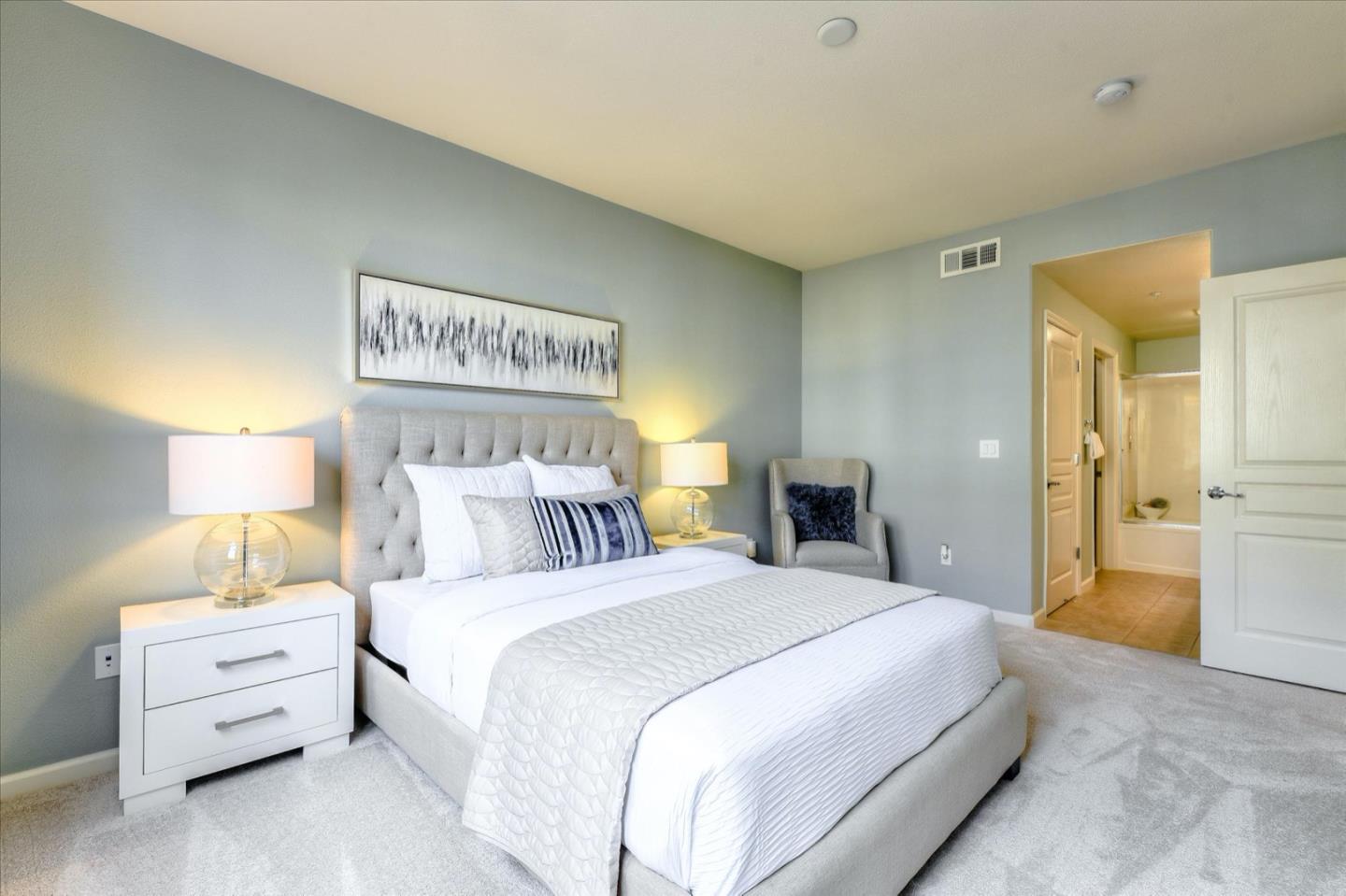 1883 Agnew Road, Unit 357 Santa Clara, CA 95054 - Photo 12 of 27 a bedroom with a bed and a night stand