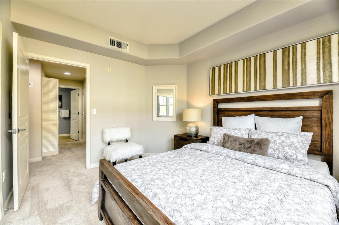 1883 Agnew Road, Unit 357 Santa Clara, CA 95054 - Photo 19 of 27 a bedroom with a large bed and a window