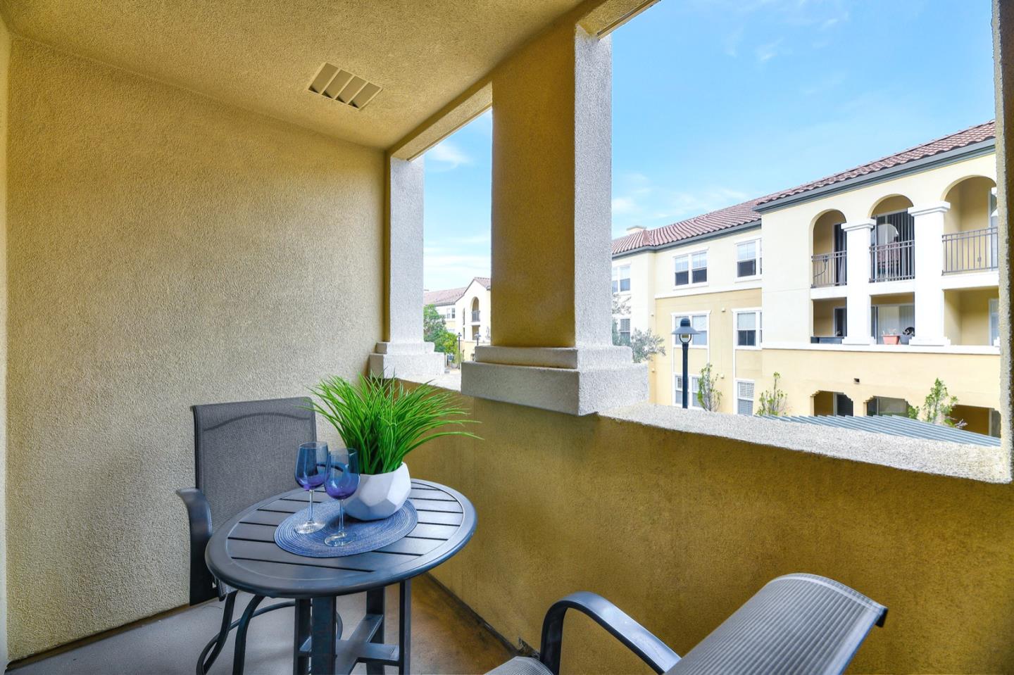 1883 Agnew Road, Unit 357 Santa Clara, CA 95054 - Photo 23 of 27 a living room with furniture and a potted plant