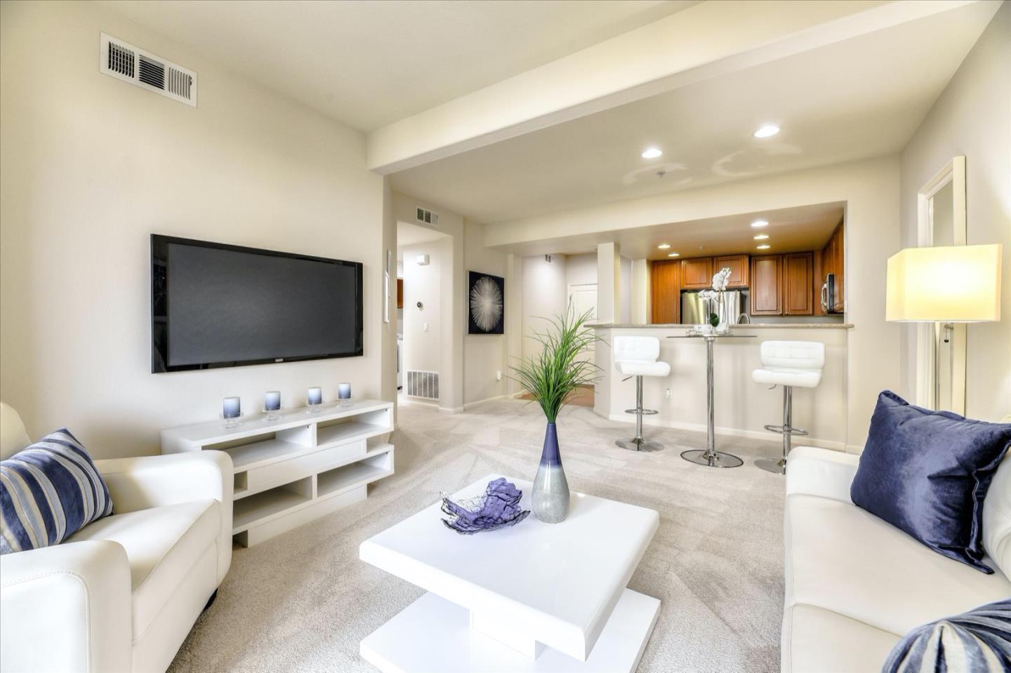 1883 Agnew Road, Unit 357 Santa Clara, CA 95054 - Photo 3 of 27 a living room with furniture and a flat screen tv