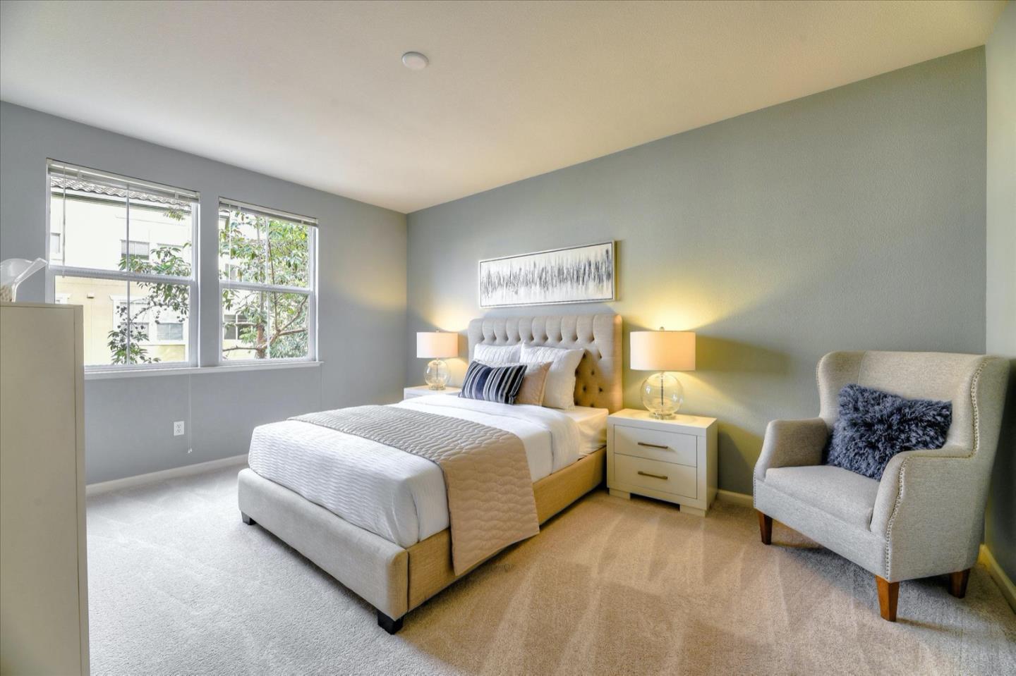 1883 Agnew Road, Unit 357 Santa Clara, CA 95054 - Photo 10 of 27 a bedroom with a bed couch and a large window