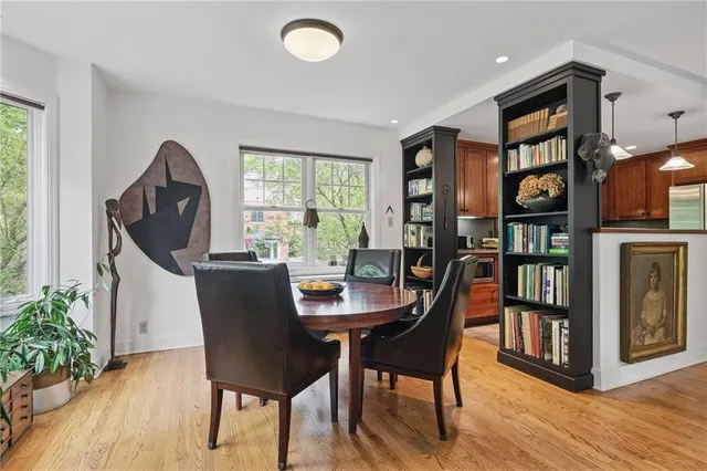 a dining room with furniture and window