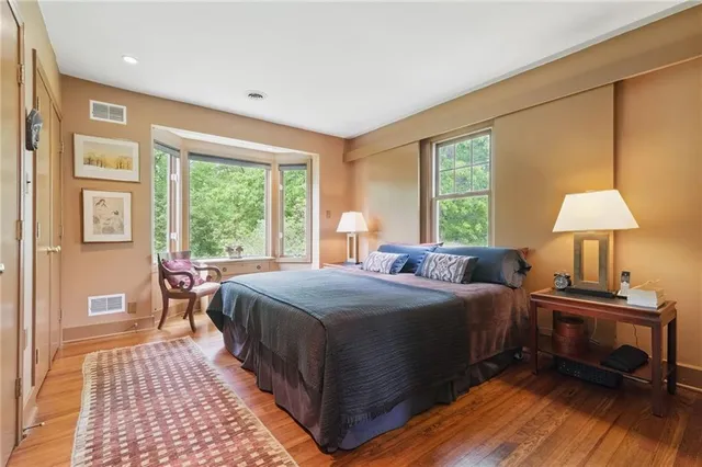 a bedroom with a bed and a table