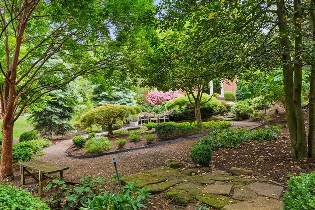 a backyard of a house with a yard and outdoor seating
