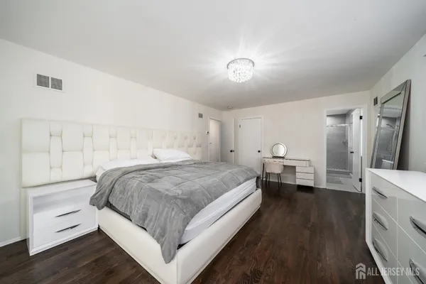 a bedroom with a bed and a closet