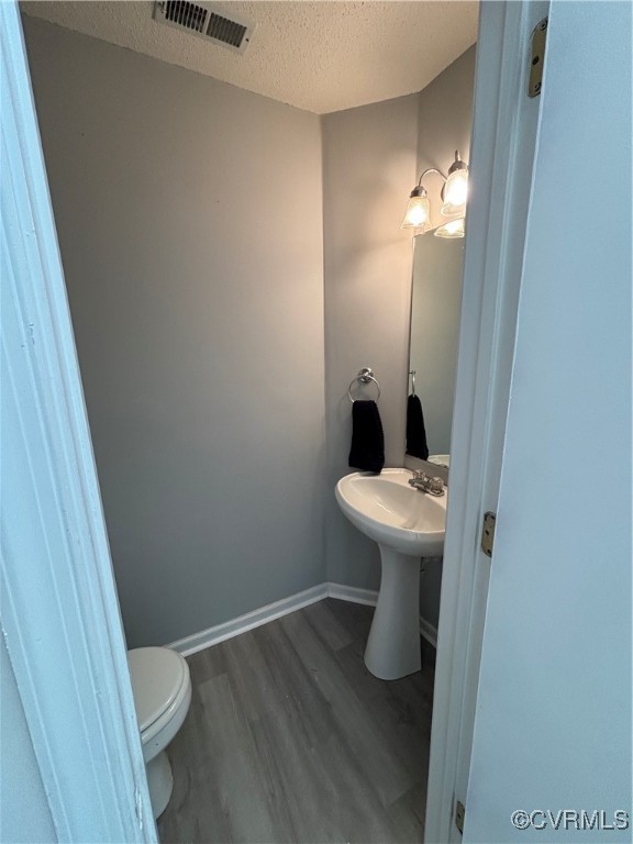 18 Bluesage Path Hampton, VA 23663 - Photo 12 of 28 Bathroom with a textured ceiling, wood-type floori