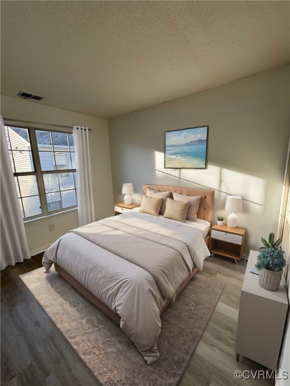 18 Bluesage Path Hampton, VA 23663 - Photo 19 of 28 Bedroom featuring a textured ceiling and hardwood