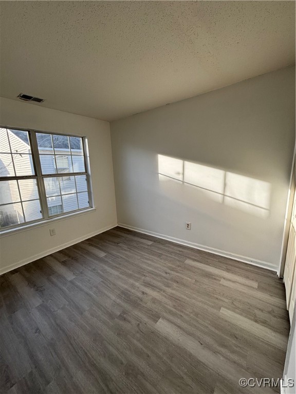 18 Bluesage Path Hampton, VA 23663 - Photo 20 of 28 Empty room featuring a textured ceiling and hardwo