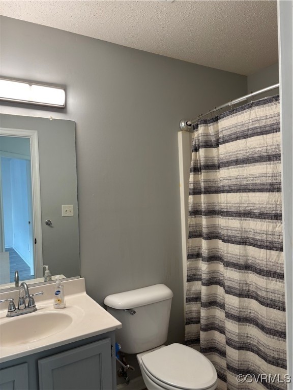 18 Bluesage Path Hampton, VA 23663 - Photo 21 of 28 Bathroom with vanity, toilet, a textured ceiling,