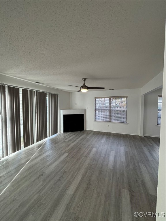 18 Bluesage Path Hampton, VA 23663 - Photo 5 of 28 Unfurnished living room featuring a textured ceili