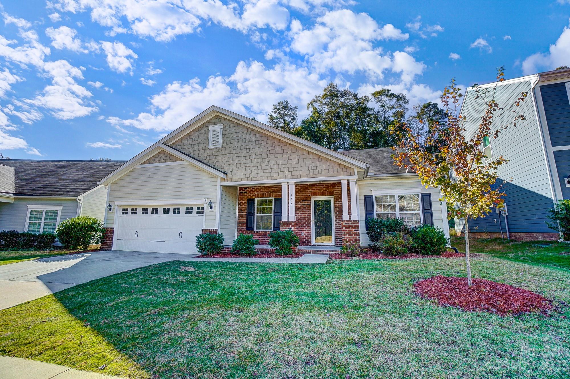 1726 Still River Way Fort Mill, SC 29708 - Photo 1 of 28 a front view of house with yard and green space