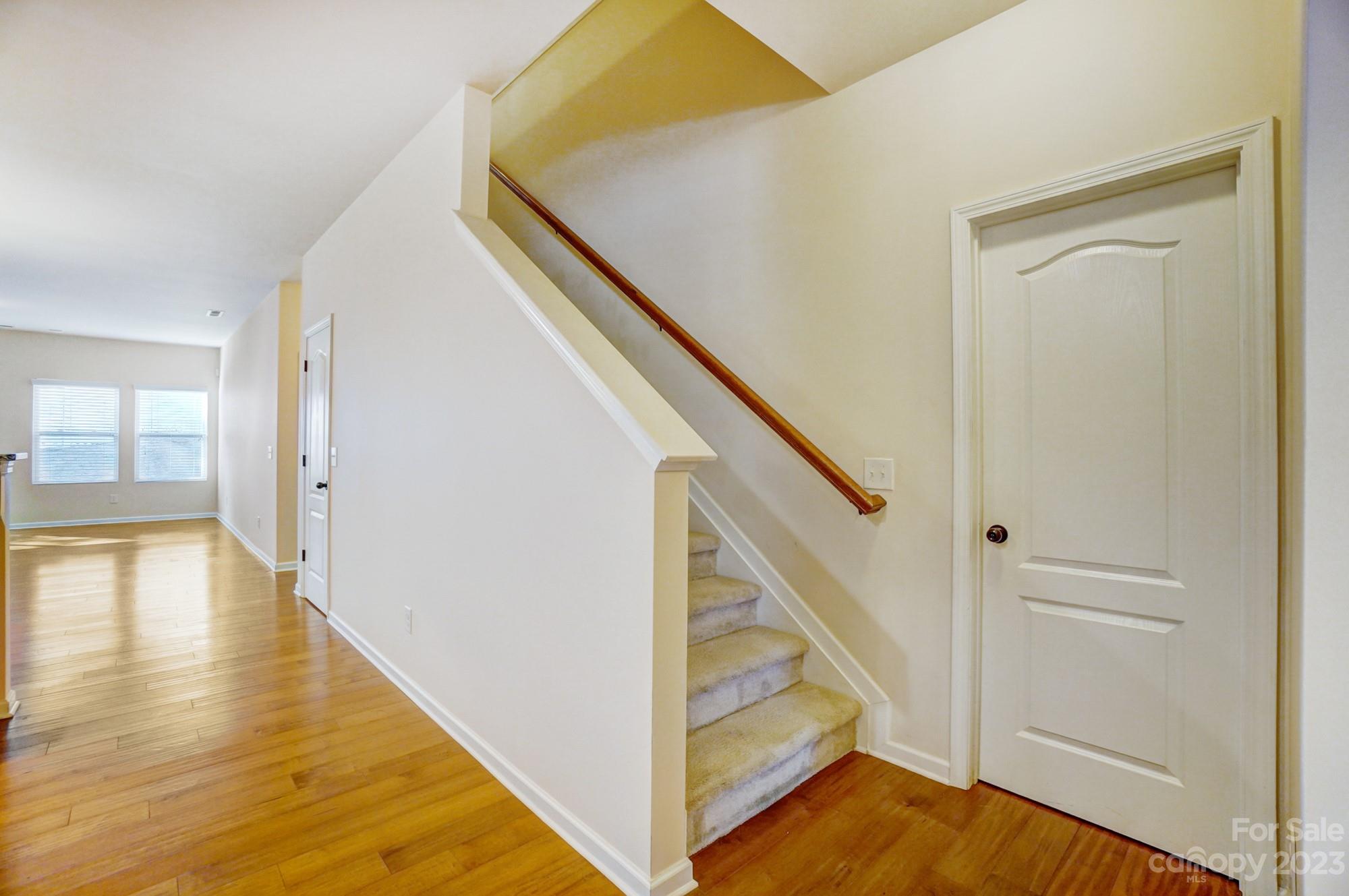 1726 Still River Way Fort Mill, SC 29708 - Photo 24 of 28 a view of an entryway with wooden floor and stairs