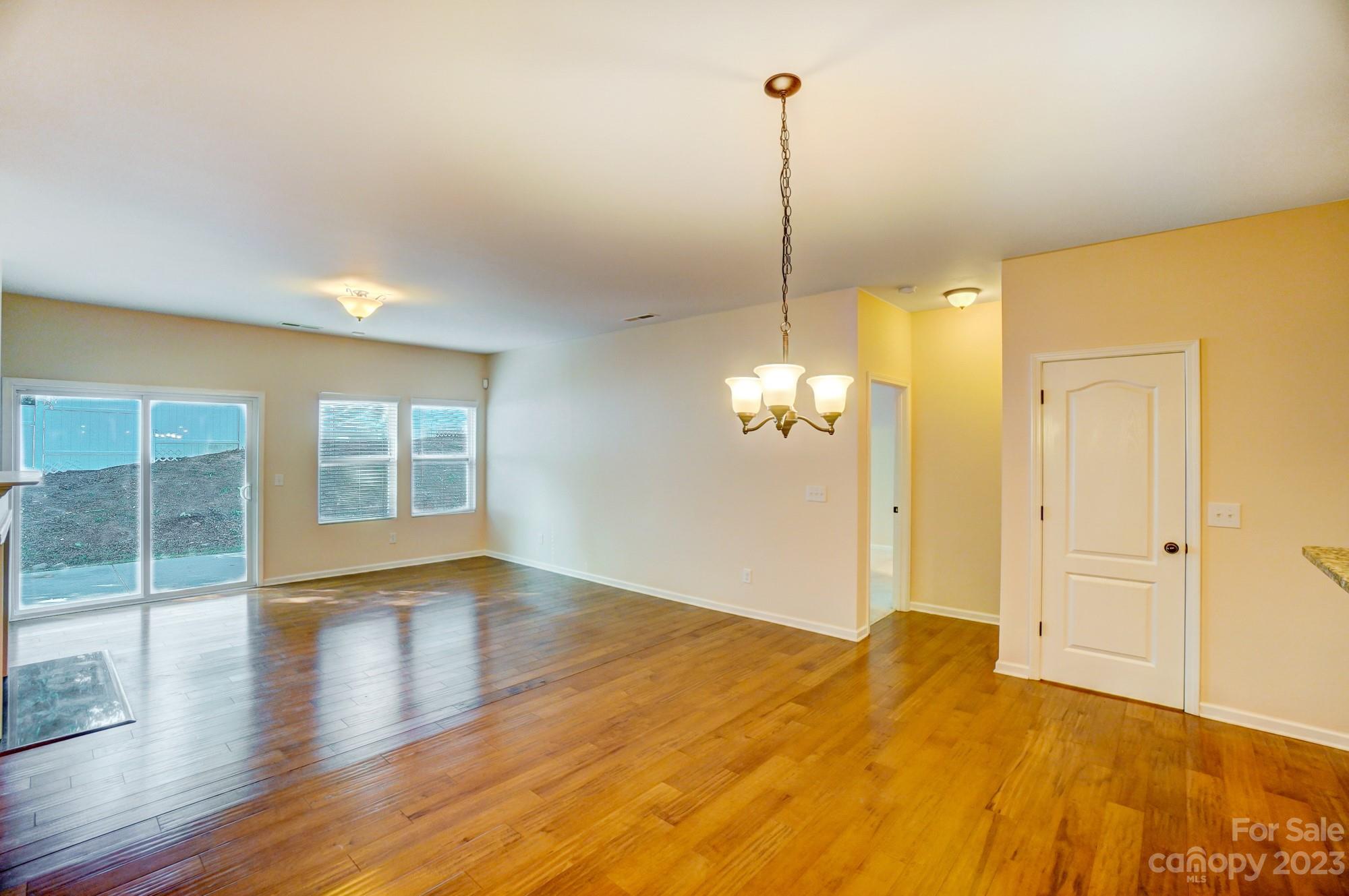 1726 Still River Way Fort Mill, SC 29708 - Photo 27 of 28 a view of empty room with wooden floor and fan