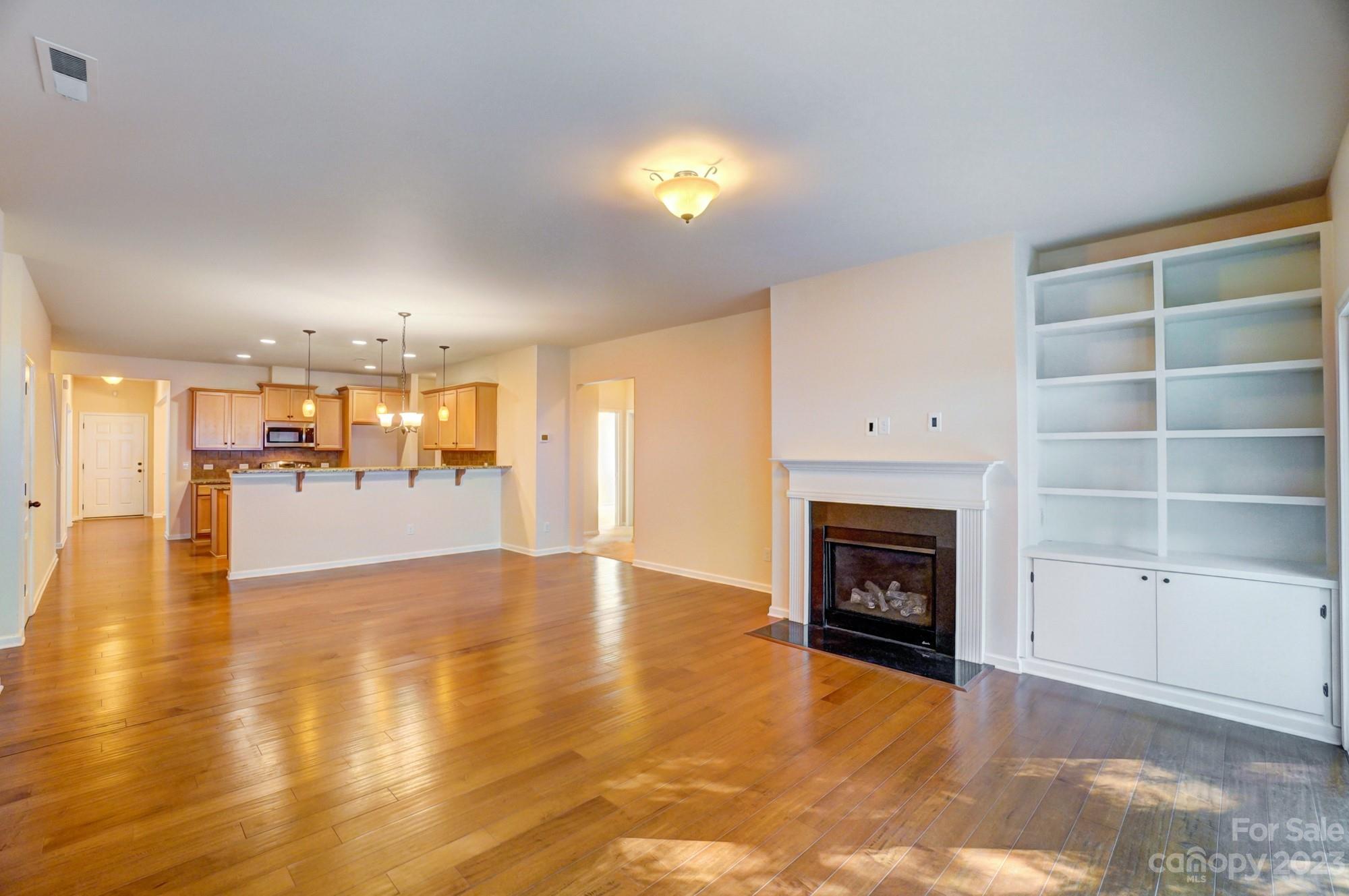 1726 Still River Way Fort Mill, SC 29708 - Photo 28 of 28 a view of an empty room with a fireplace and window