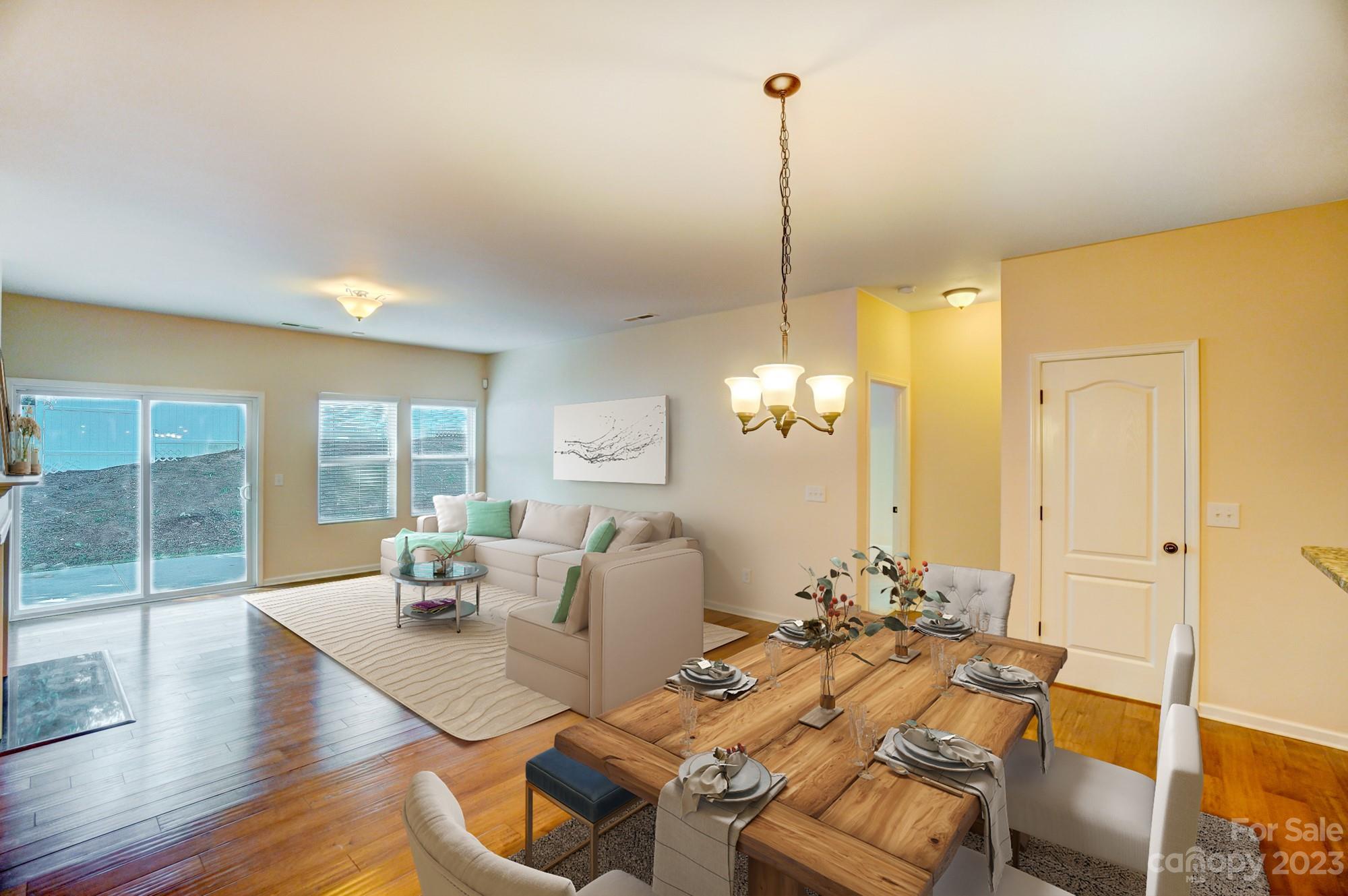1726 Still River Way Fort Mill, SC 29708 - Photo 6 of 28 a view of a dining room with furniture wooden floor and chandelier