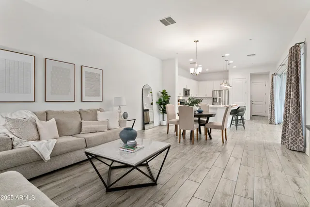 a kitchen with stainless steel appliances granite countertop white cabinets and a stove