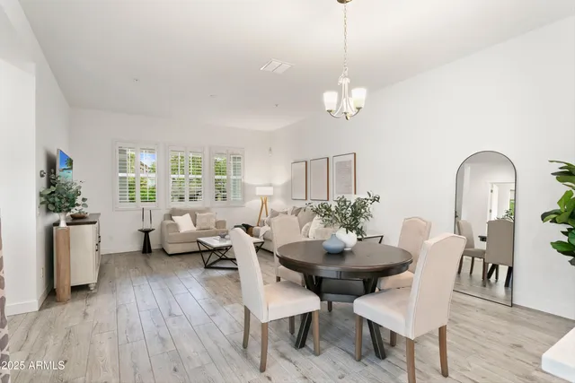 a bathroom with double sink and a mirror