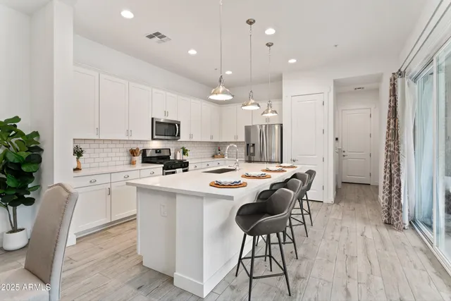 a bathroom with a shower and a sink