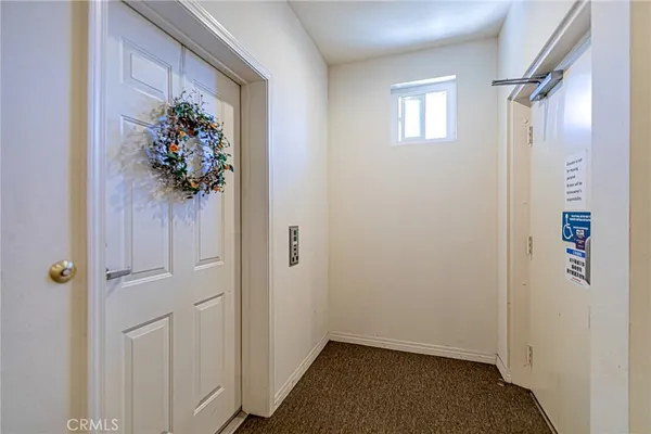 a view of a hallway with a flower pot