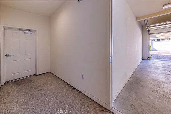 a view of a hallway with a window