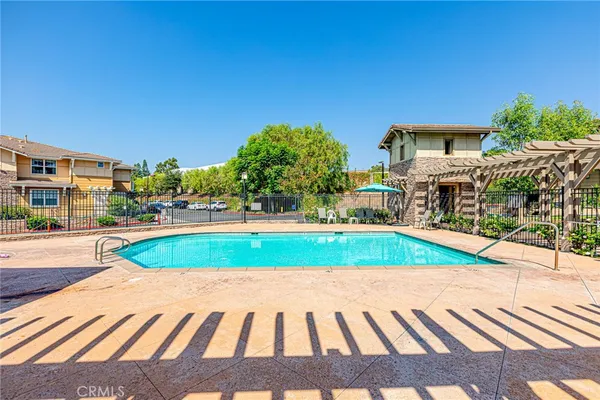 a view of a swimming pool with a patio