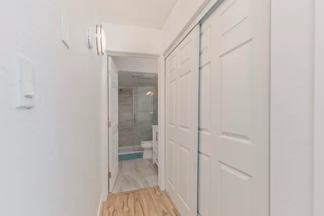 a bedroom with a bed and a table