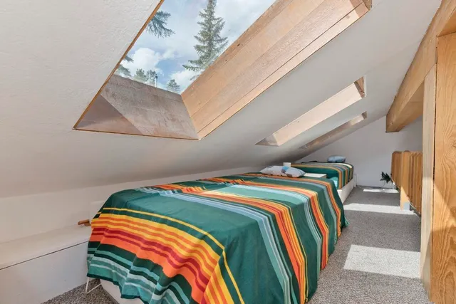 a bathroom with a toilet a sink a vanity and mirror