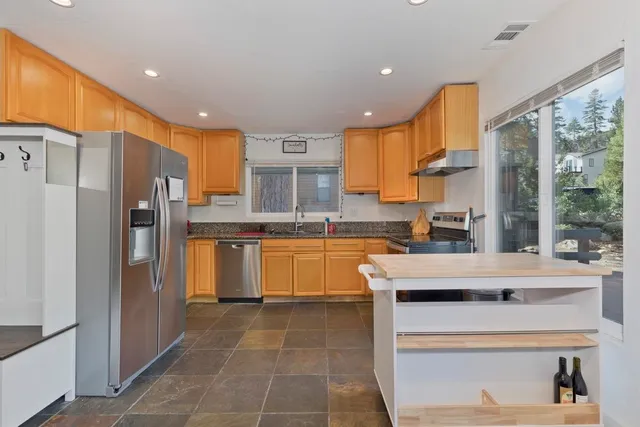 a view of a livingroom with furniture and a flat screen tv