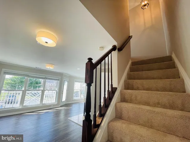a view of an entryway with wooden floor