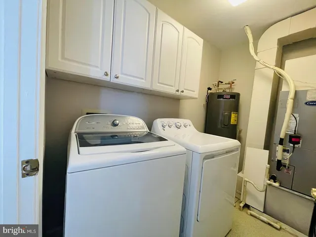 a table with a vase and a window of it