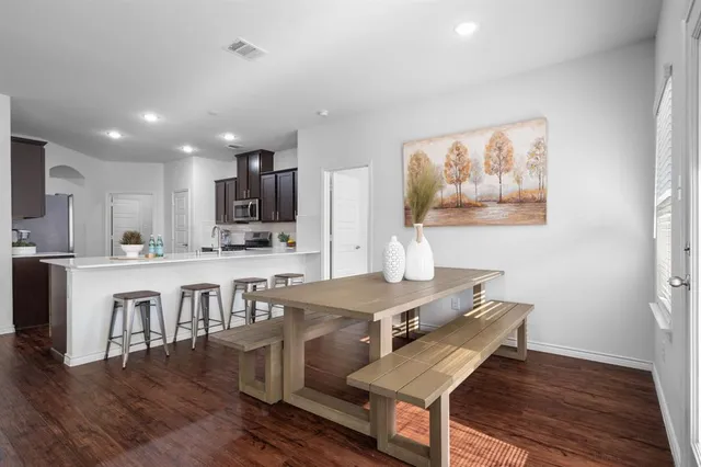 a view of kitchen with cabinets and wooden floor
