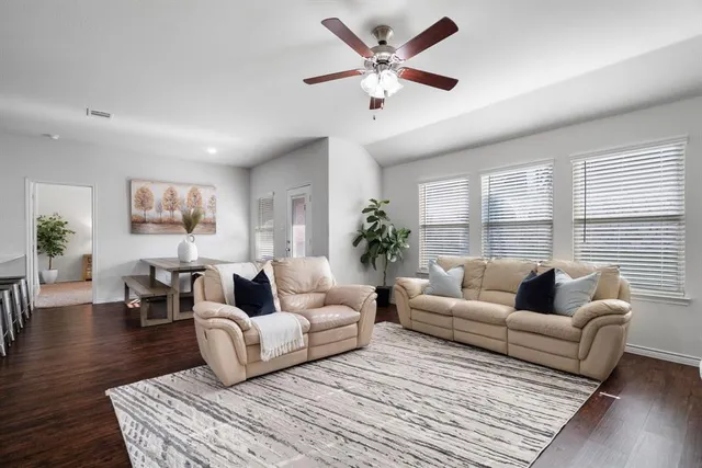 a living room with furniture or couch and a large window