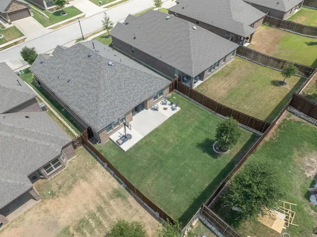 an aerial view of a pool table and chairs