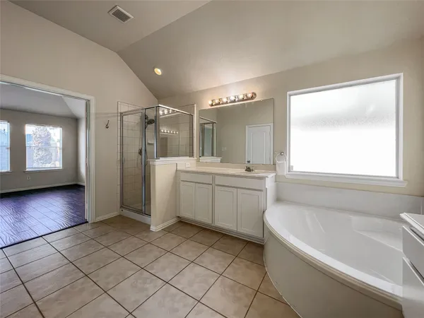 a bathroom with a sink a toilet and bathtub
