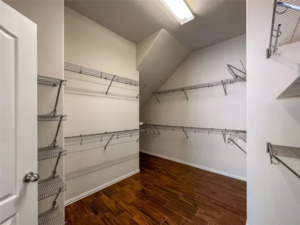a view of a room with racks on the wall