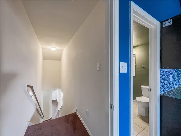 a view of a hallway with seating area